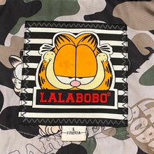 Load image into Gallery viewer, Lalabobo Garfield Sequin Logo Camo Racoon Fur Trim Hooded Jacket Women’s Large