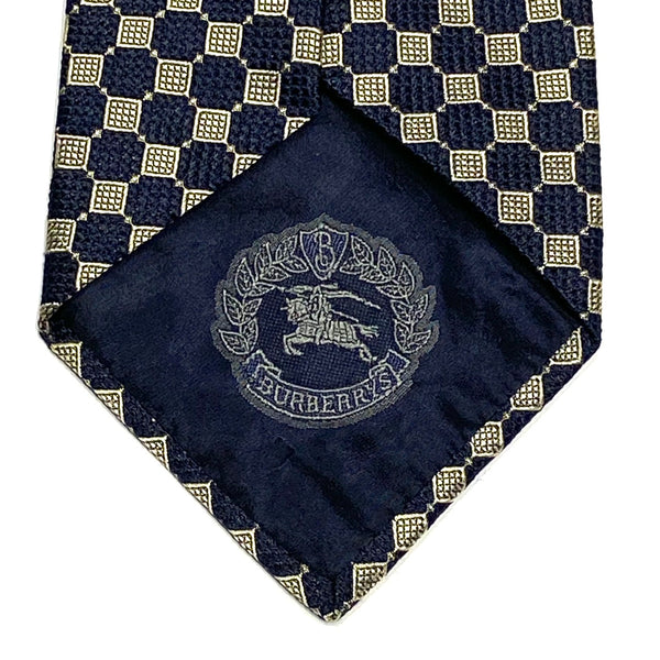 Closeup view of Burberrys Equestrian Knight Logo on inside of Vintage 90’s Burberrys of London Silk Necktie