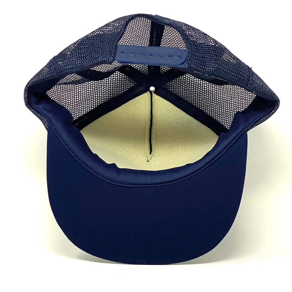 Bottom-inside view of navy blue vintage 90’s NASA Kennedy Space Center Snapback Trucker Hat with Felt Image.